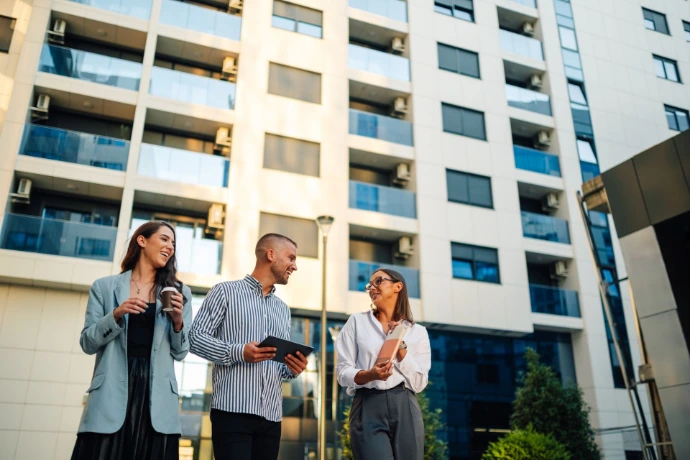 People laughing outside building